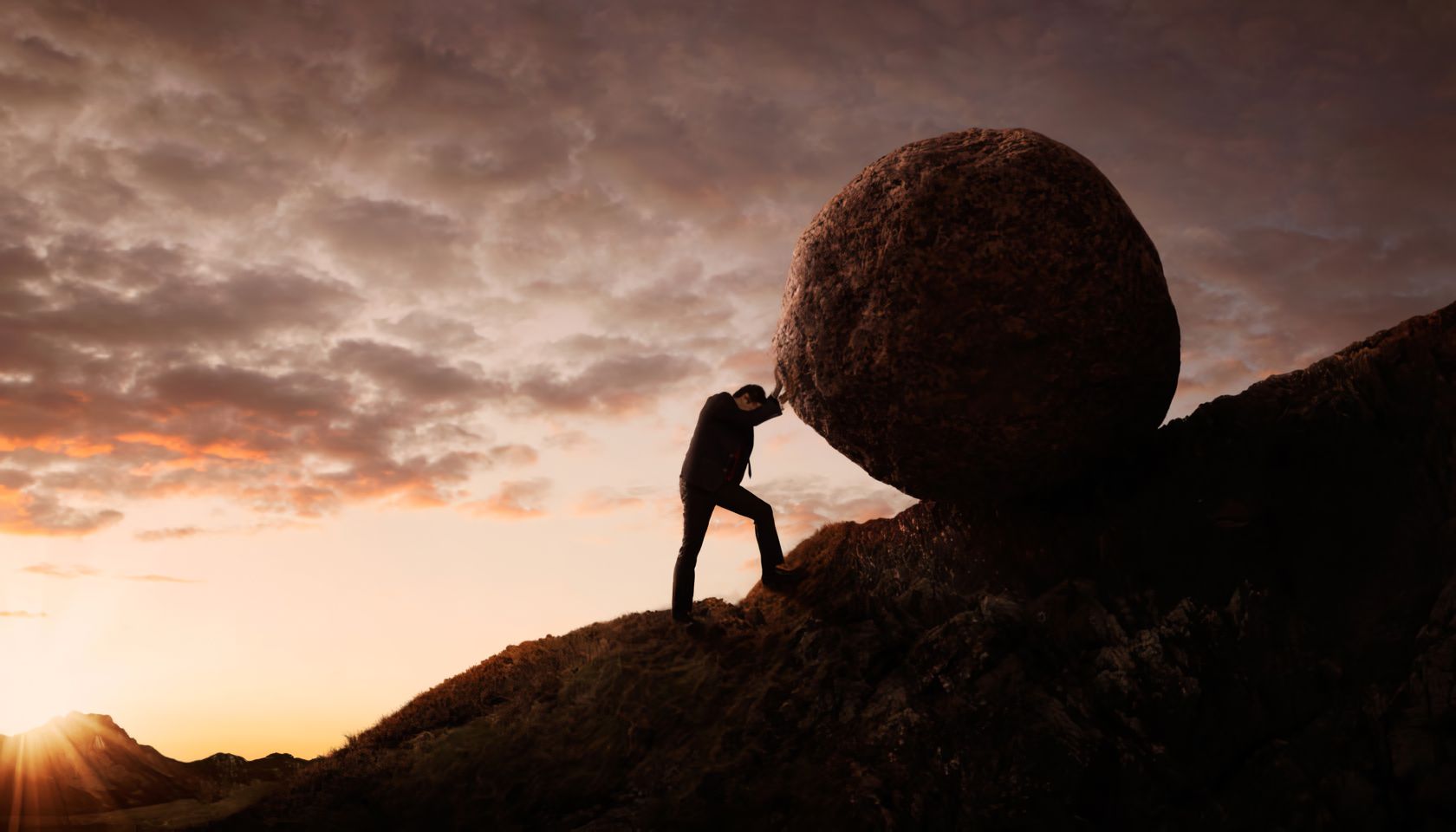 pushing a boulder uphill